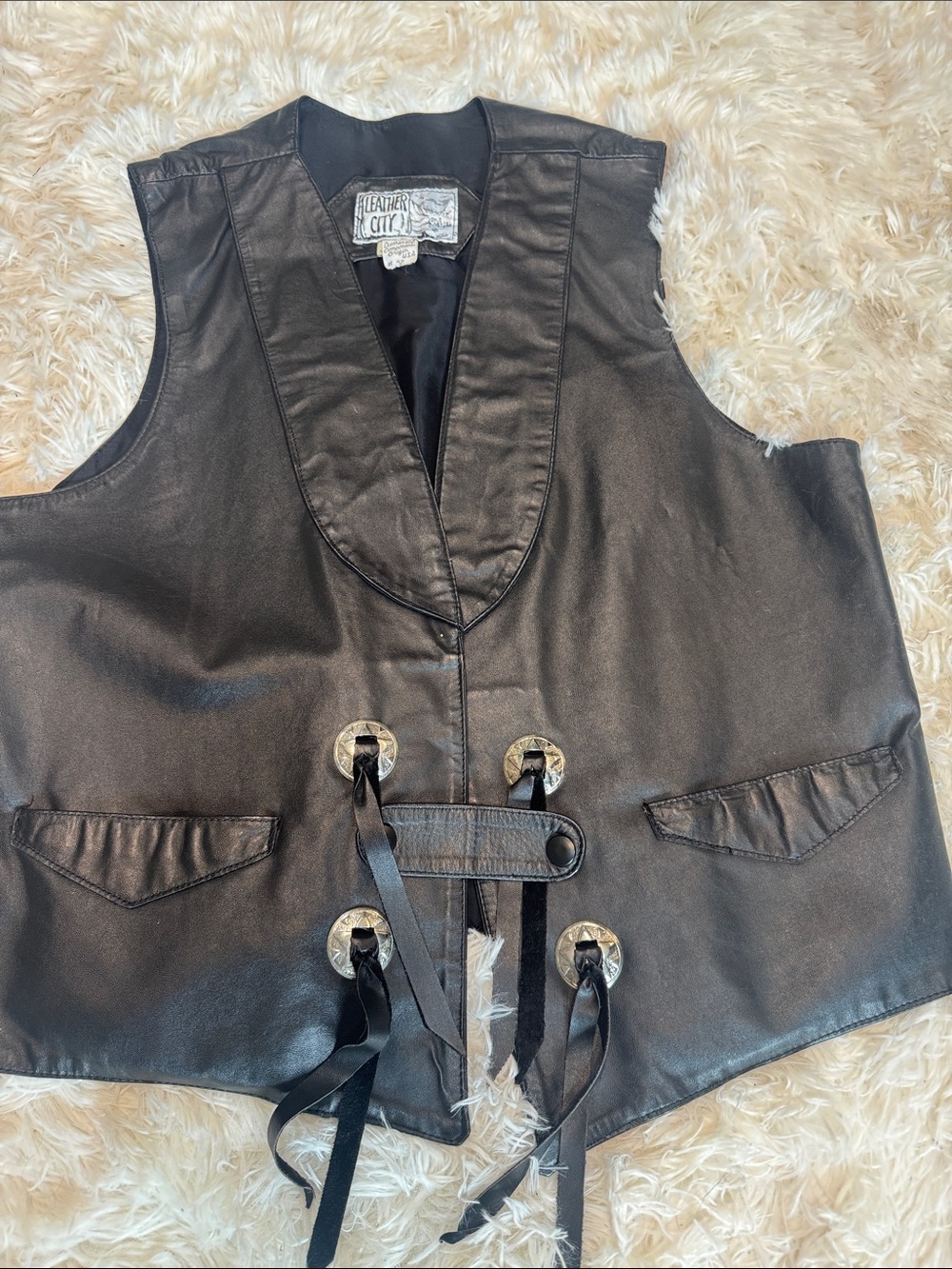 Black Leather Lace-Up Vest with Decorative Conchos